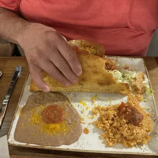 House special giant fried taco with beans and rice.