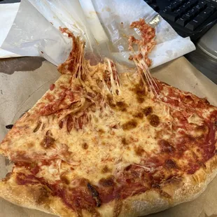 a slice of pizza on a table