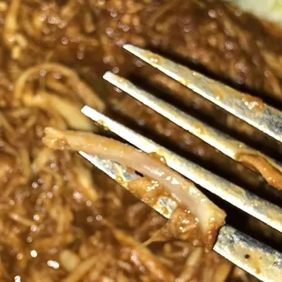 a fork in a plate of food