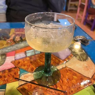 a margarita in a glass on a table