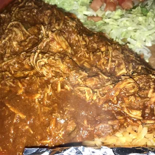 a plate of food with meat and noodles