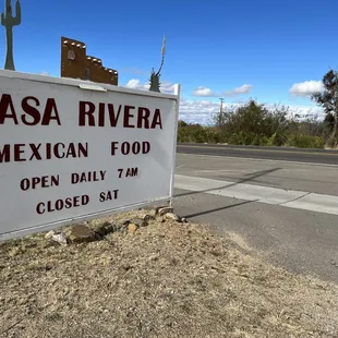 a sign on the side of the road