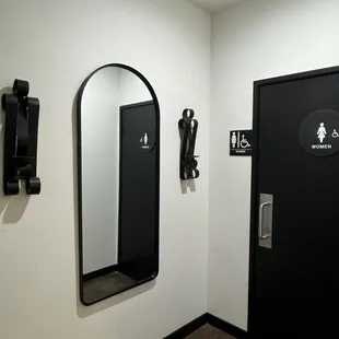 Entrance to the women's restroom with a beautiful full length mirror.