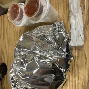 Taco salad to go with cheese sauce, red salsa and salsa picante.