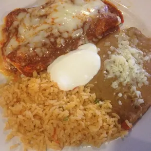 Chicken enchiladas with rice and beans