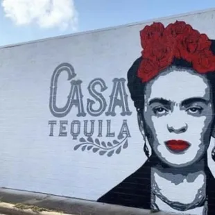 a woman with a red flower in her hair