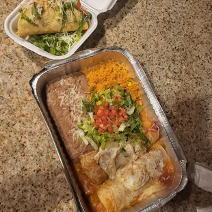 a mexican meal in a foil container