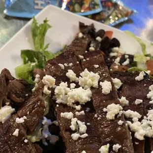 steak salad, with packaged dressings