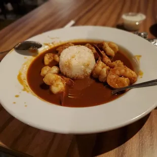 a plate of food on a wooden table