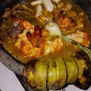 a plate of food with shrimp and vegetables