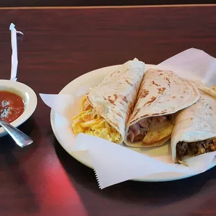 Migas, ham and potato, and egg and chorizo breakfast tacos.