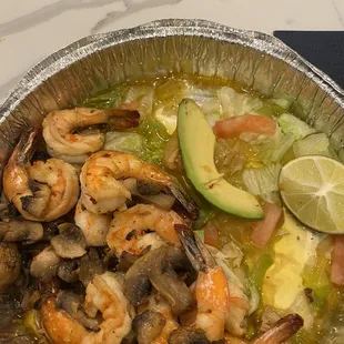 One lousy slice of avocado over a lettuce swamp