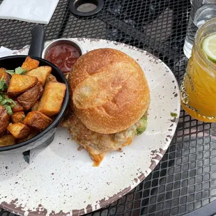 Carnitas torta with patatas bravas. Passion fruit margarita pictured at right.