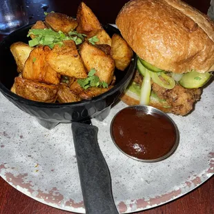 Fried chicken torta: buttermilk-brined fried chicken sandwich, almond mole aioli, chipotle aioli, homemade bread and butter pickles