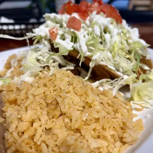 Rice and shredded beef tacos
