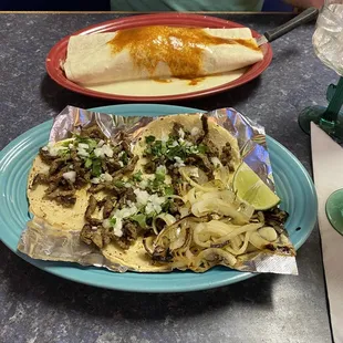 Tacos mexicanas with steak (front) and California Burrito (back)