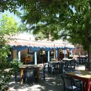 tables and chairs in a courtyard