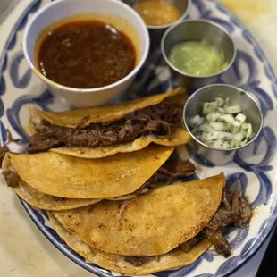 Quesa-birria tacos served with rice &amp; beans on the side