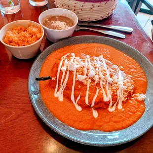 Amazing.... Beef and veggie filled Chili Relleno. This sauce is light and disguised as heavy. It rocks. Pintos and rice... Omg.