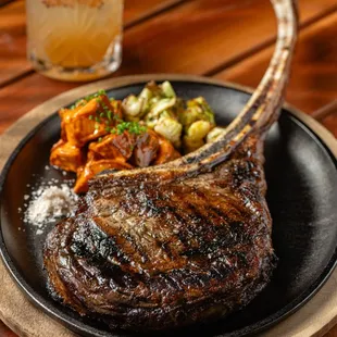 a plate of steak and vegetables