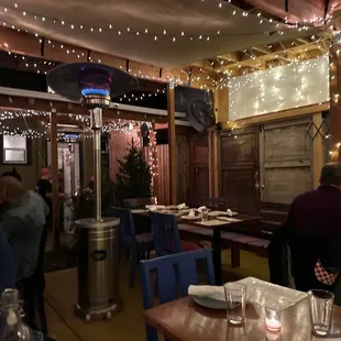 people sitting at tables in a restaurant