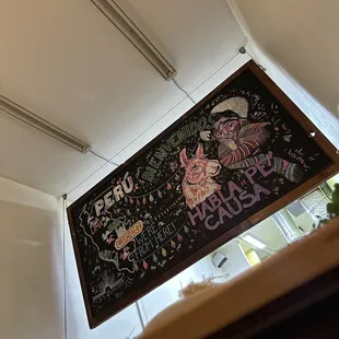 a blackboard with a drawing of a cat