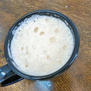 a cup of coffee on a table