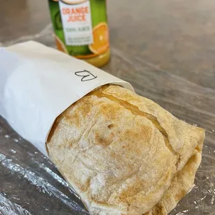 a burrito wrapped in plastic