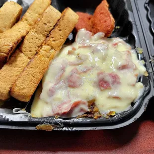 Creamed chipped beef on top of home fries.