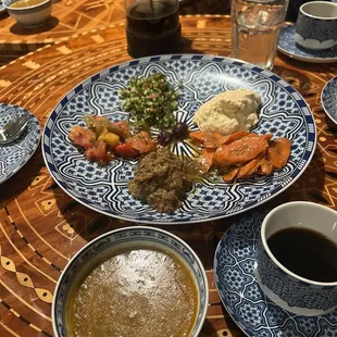 Soup, Moroccan spice coffee On the plate there is hummus,carrots, eggplants, and cucumbers
