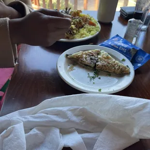 a person eating a slice of pizza