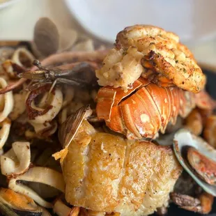 a plate of seafood and clams