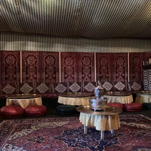 tables and chairs in the middle of the room