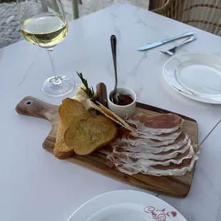 Prosciutto and Parmesan with a jelly spread and rosemary. Breaking piece off the rosemary into the spread was delicious with the cheese!