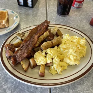 Bacon, sausage, fluffy eggs and some country potatoes. Food was great
