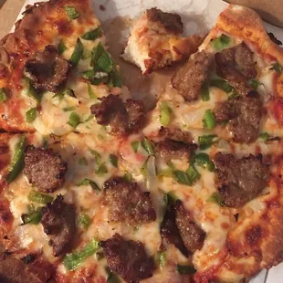 Small pizza, sausage onion green pepper.