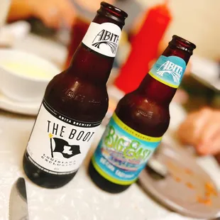two bottles of beer on a table