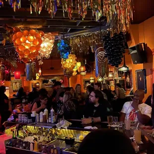 a crowd of people at a bar