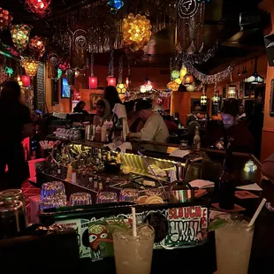 a view of a bar with cocktails