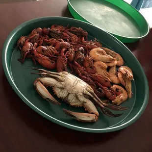 a plate of lobsters and shrimp