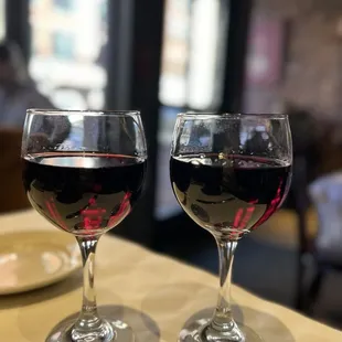 two glasses of wine on a table