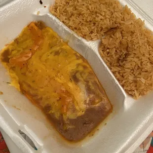 Child&apos;s plate cheese Enchiladas with rice.