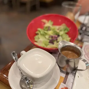 a bowl of soup and a bowl of salad