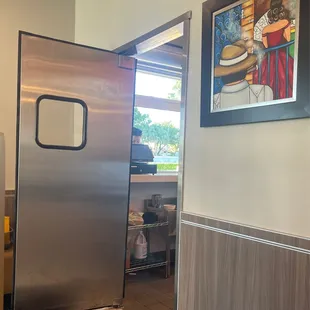 They leave this door open and all the flies come in. It's so hot in the restaurant