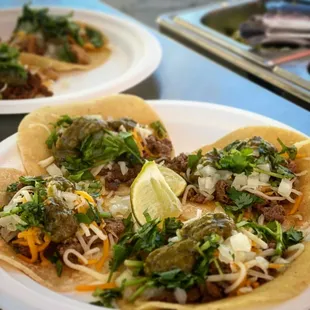 three plates of mexican food