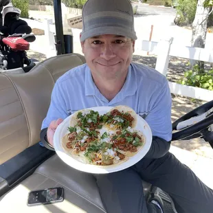 a man holding a plate of food
