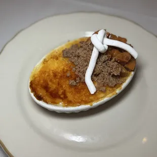 Vanilla creme brûlée with candied sweet potatoes, maple pecan crumble, and marshmallow