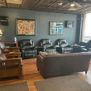 a living room with leather furniture