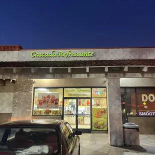 a car parked in front of the store