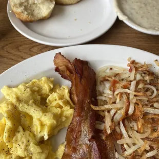 Delicious food with homemade biscuits, real butter, and sausage gravy southern style